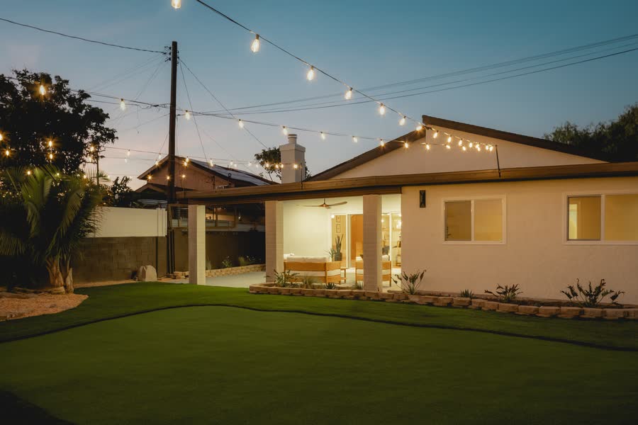 Garden under string lights at dusk