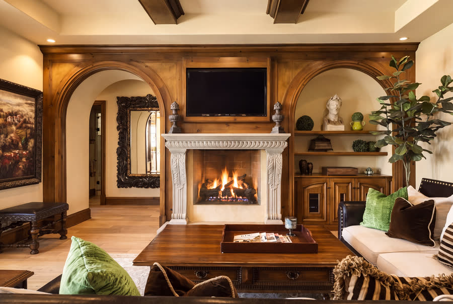 Family room with carved stone fireplace