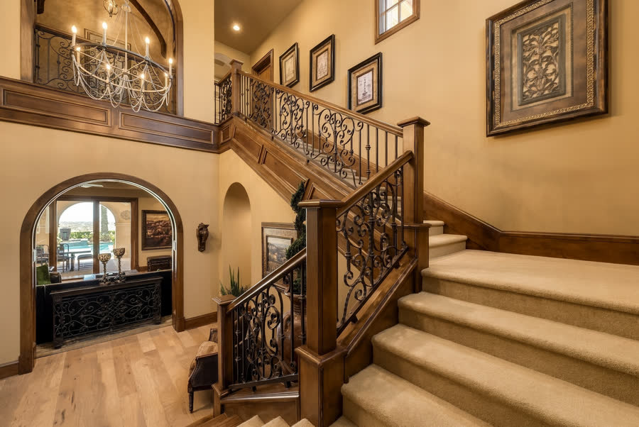Iron-railed stair from the foyer