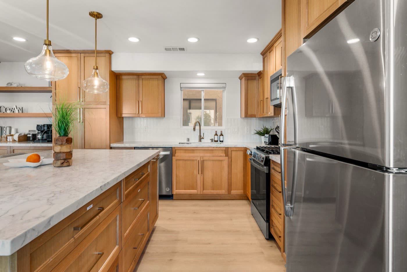 A bright kitchen with oak cabinets, photographed in HDR